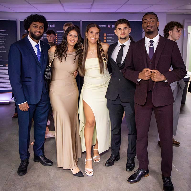A group of students looking smart in formal dress