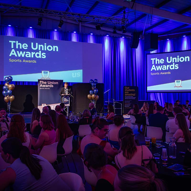 Conference centre with a man on stage