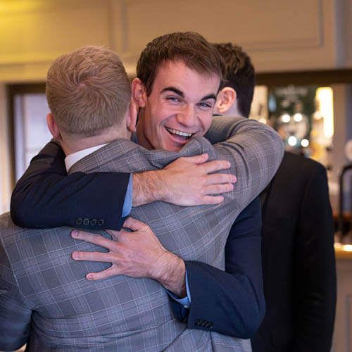 Two students hugging